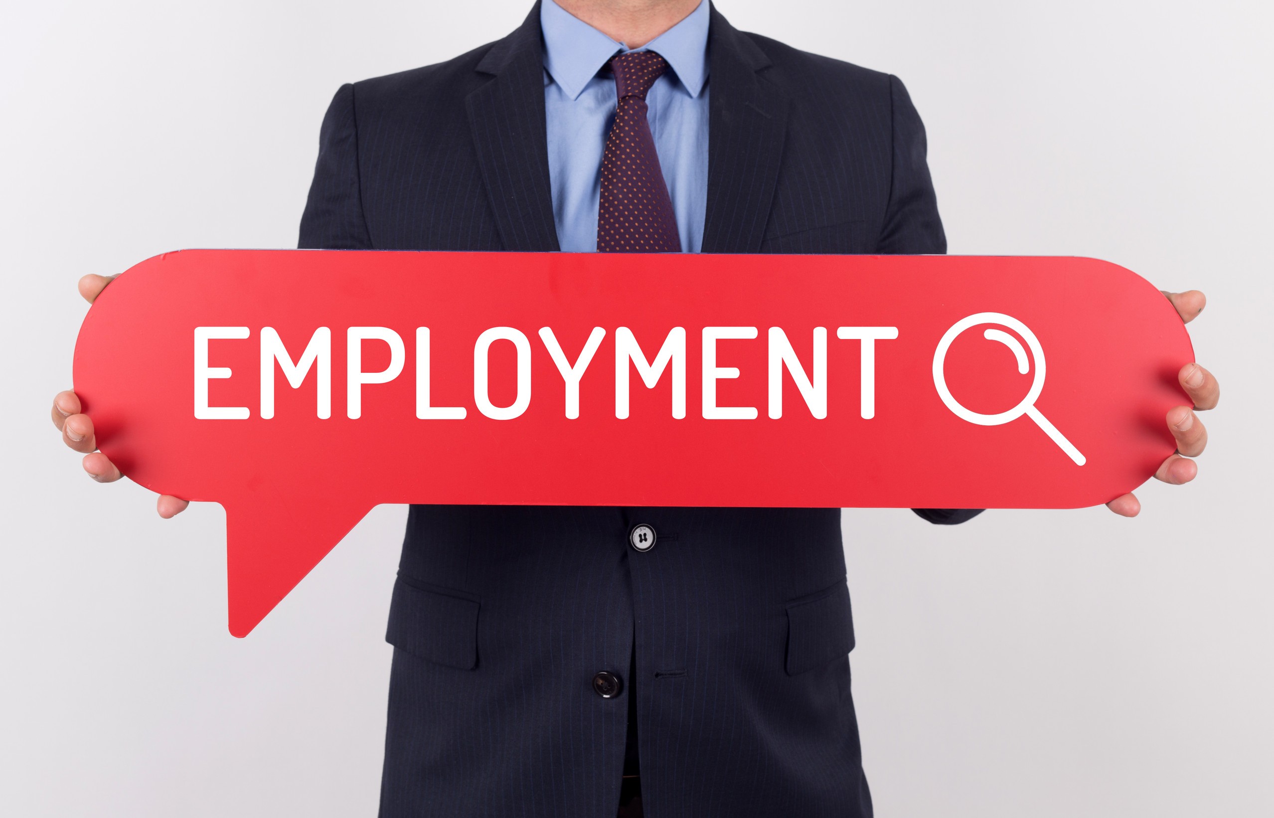 businessman holding speech bubble with a word employment
