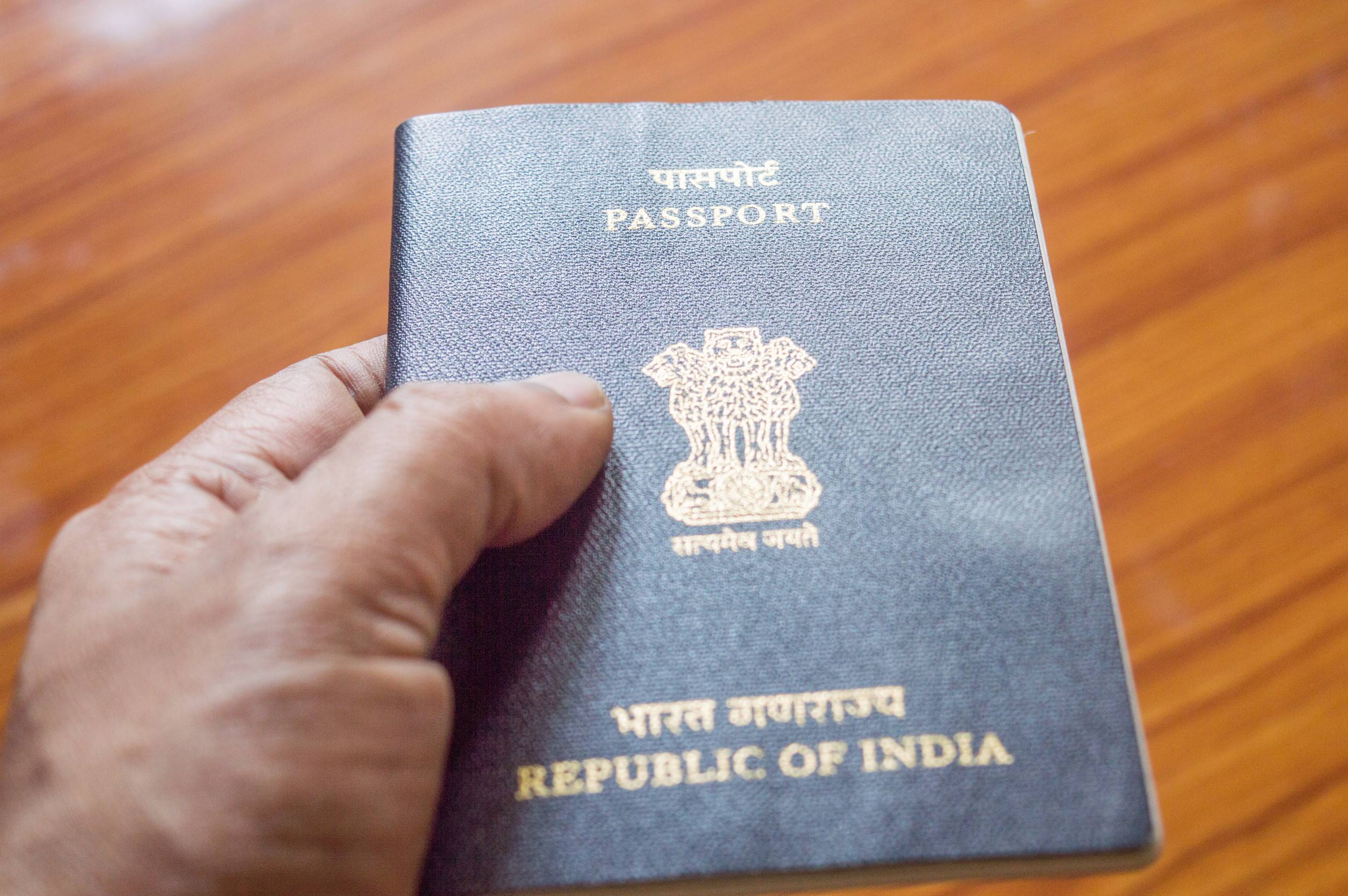 Indian passport held in hand