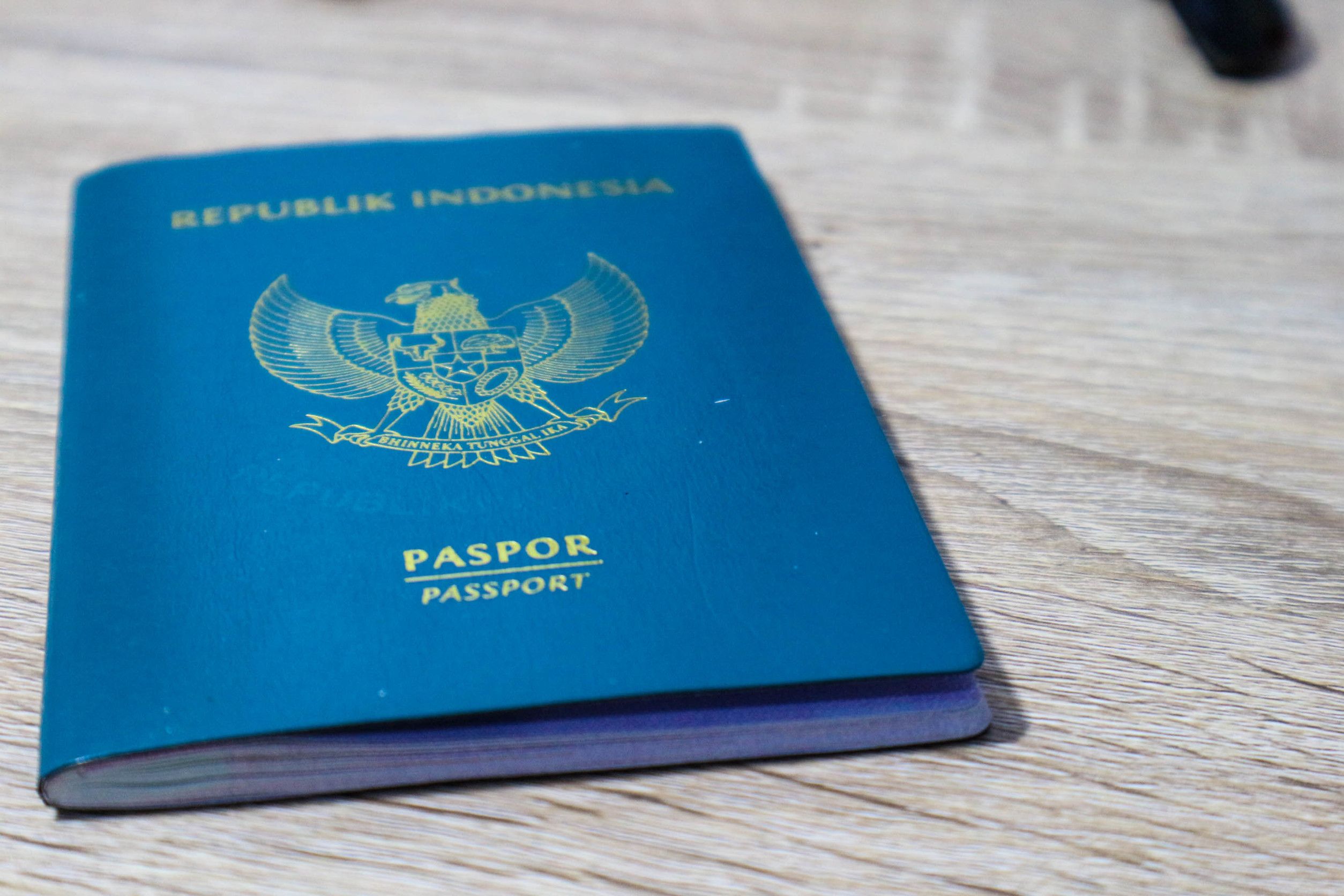 Indonesian passport on wooden table