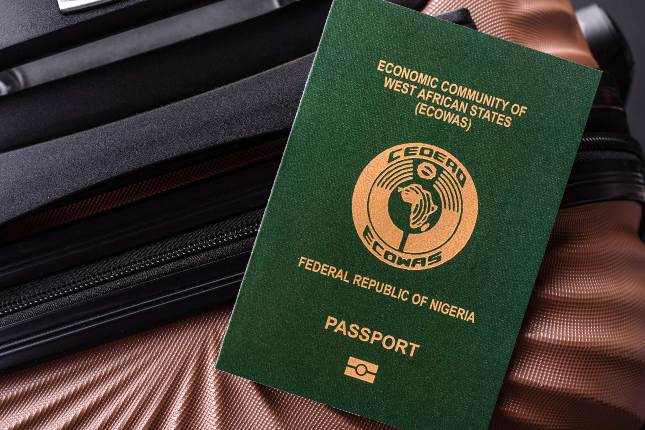 Nigerian passport on travel bag