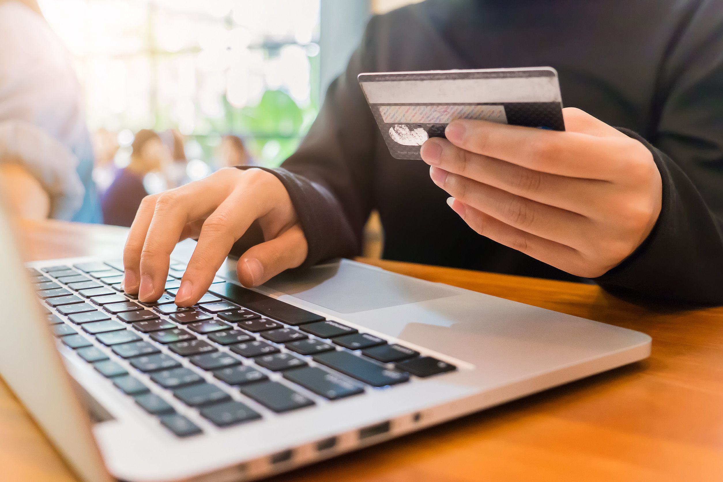 Online payment on laptop with card